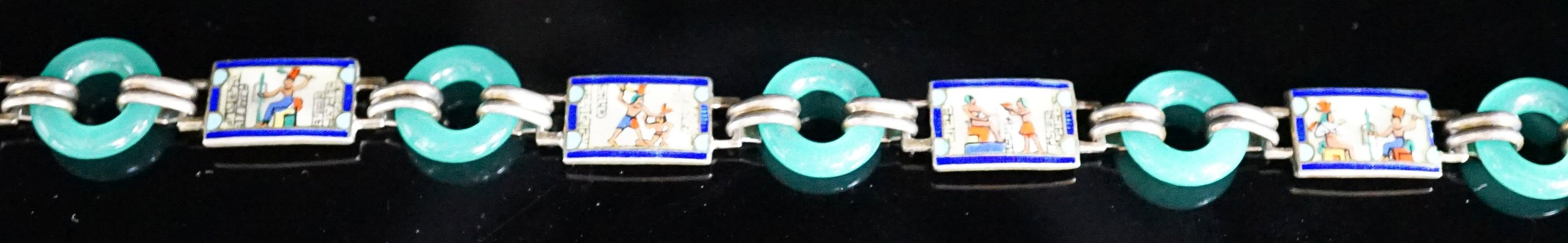 A 20th century Egyptianesque gilt white metal, enamel and chrysoprase loop set bracelet, 18cm.